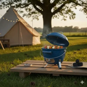 A close-up of a blue ceramic barbecue lid showing the cast iron top vent and temperature gauge, used for precise control when using Big Green Egg alternatives.