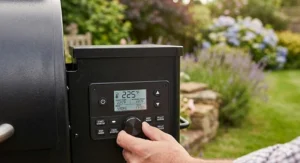 A wood pellet smoker being used for outdoor baking, demonstrating the versatility of modern convection-style smokers for UK homeowners.
