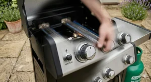 Illustration of a push-button piezo ignition system on a budget-friendly 3 burner gas barbecue.