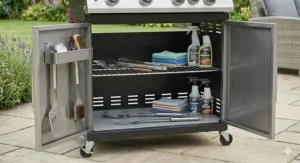 View of a gas BBQ showing the spacious internal cabinet storage for gas canisters.