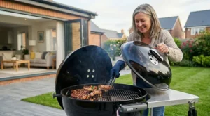 A sturdy, heavy-duty steel barrel smoker designed for durability in varying British weather conditions.