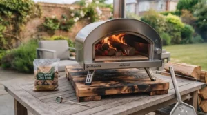 Close-up of a wood pellet being fed into an affordable outdoor pizza oven.