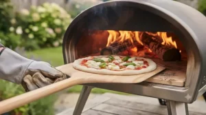 A wooden peel sliding a fresh Neapolitan-style pizza into the roaring hot interior of a brick pizza oven.