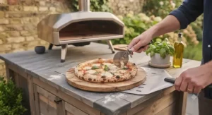Freshly baked homemade pizza with melted mozzarella and fresh basil cooked in a gas pizza oven.