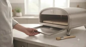 Stainless steel electric pizza oven showing easy-to-clean exterior housing and removable crumb tray