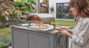 Inside view of a preheated outdoor electric pizza oven showing the hot cordierite baking stone.