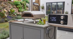 A plug-and-play outdoor electric pizza oven being connected to a weatherproof garden power socket.
