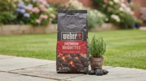 Packaging of Weber barbecue briquettes showing product details and bag size for UK buyers.