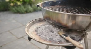Minimal ash residue left after burning quality lumpwood charcoal in a garden BBQ.