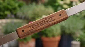 Ergonomic heat-resistant wooden handles on a BBQ tool set for safe flipping burgers and sausages on the patio.