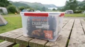 Waterproof container keeping instant light charcoal dry during unpredictable British weather.